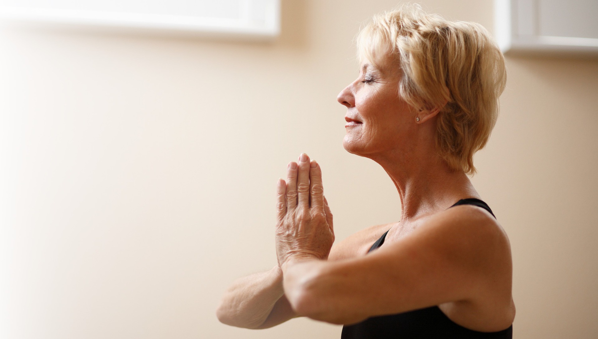 woman with short hair sitting in meditation